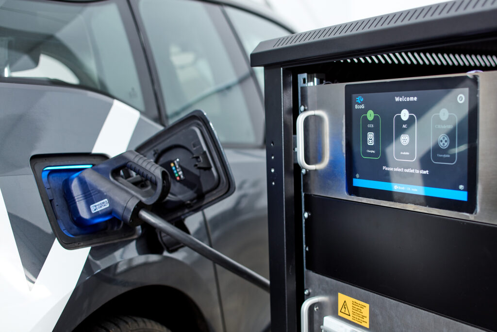 A charging station using the EcoG platform charges an electric car