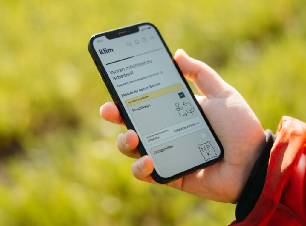 An image of the Klim app on a mobile phone